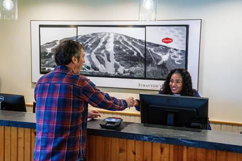 Guest at customer service desk at Stratton Mountain Resort in Vermont 