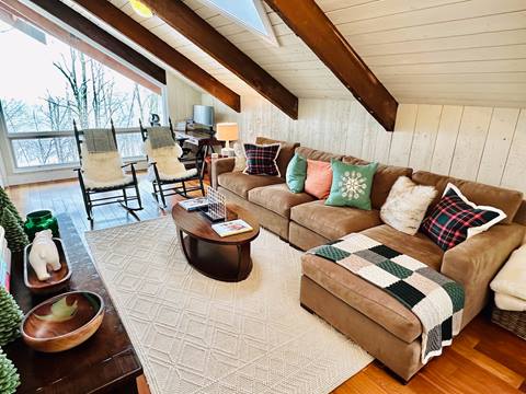 74 North Brookwood Rd Private Home Rental living room with exposed beam and high ceiling