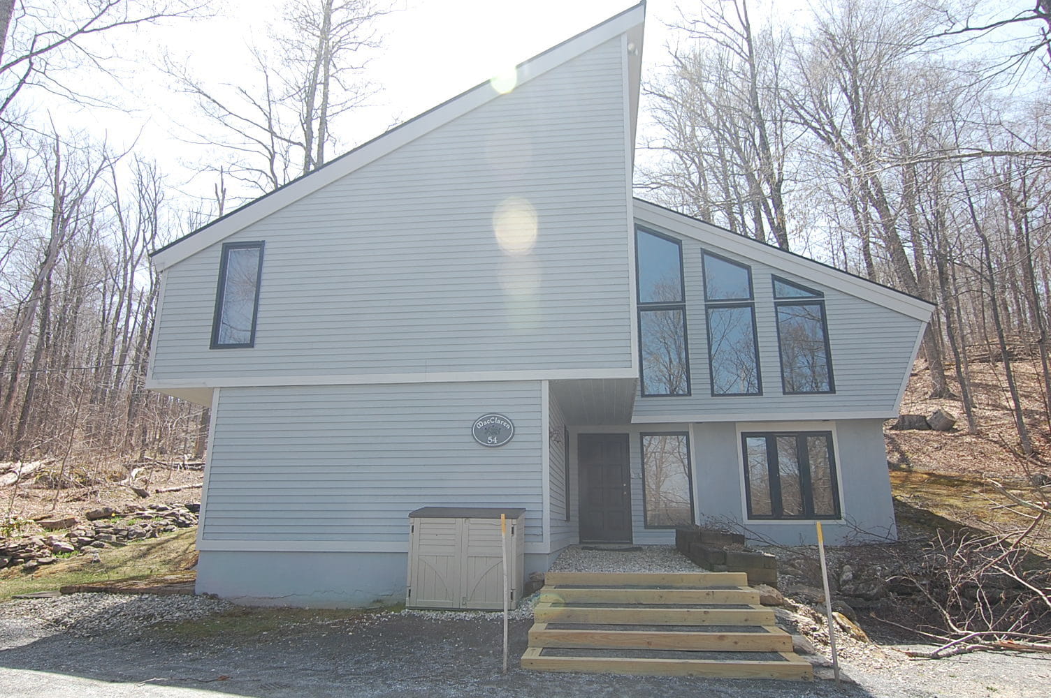 Modern Vermont real estate home exterior at North Branch seasonal rental with 4 bedrooms and 3 baths surrounded by Stratton’s lush mountain woods