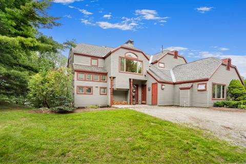 Front exterior view of Piper Ridge home in Stratton Vermont, featuring southern Vermont real estate for sale in a private mountain community