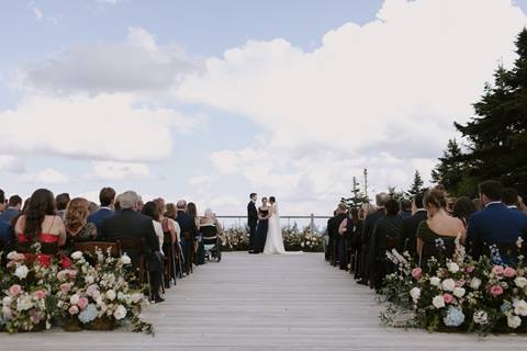 A couple at their wedding on the Stratton Mountain Yoga Deck