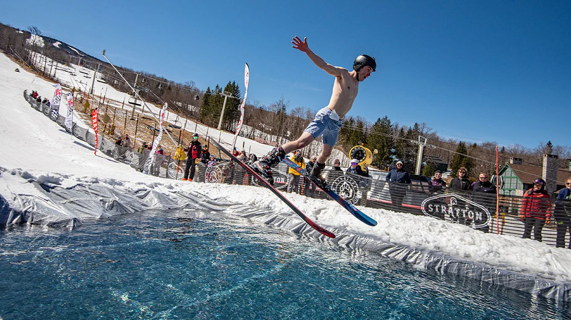 Man Jumping into Pond at Stratton's Pond Skim