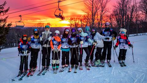 24 Hours of Stratton ski group standing at sunrise